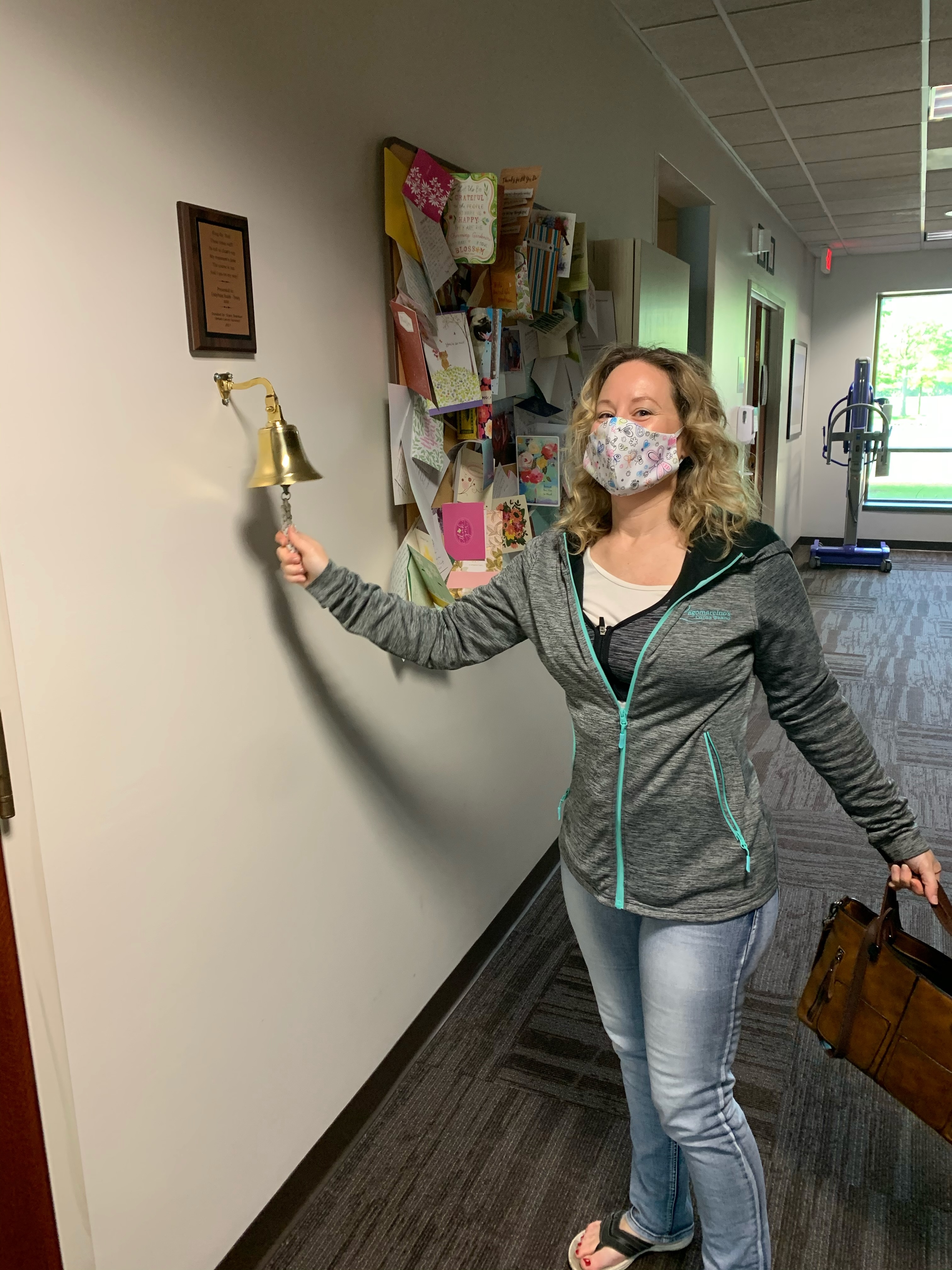 Sarah ringing the bell at the end of radiation treatment, May 2020